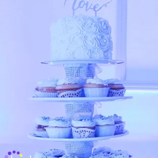 Beautiful wedding cake at Clubhouse at Woodcreek Roseville with Soft Blue Uplighting | Brighten Up Event Lighting