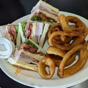 Clubhouse Sandwich for $13.95 + $1.25 up-charge for Onion Rings.