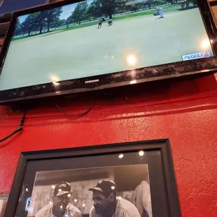 two men playing golf on television