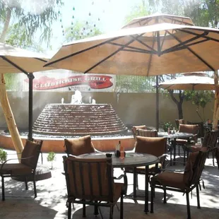 outdoor dining area with tables and umbrellas