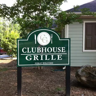 a sign in front of a house