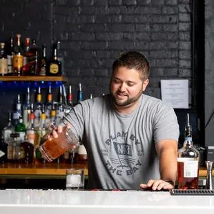  a bartender pouring a drink