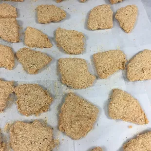 Hand breaded provolone triangles ready for the fryer