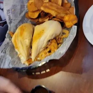a plate of sandwiches and chips