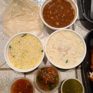 Medium rice, medium beans, and medium potato salad. 1 packet of tortillas and salsa.