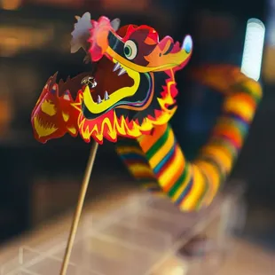 a colorful dragon on a stick