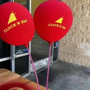 Cute balloons outside at the picnic table