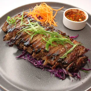 a plate of meat and vegetables