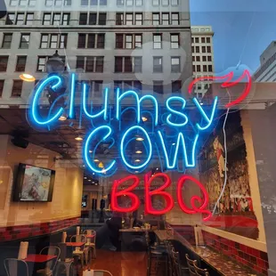 The front window of Clumsy Cow BBQ