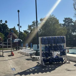 Life jackets and loungers by the pool