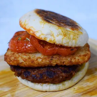 an english muffin sandwich with tomato sauce