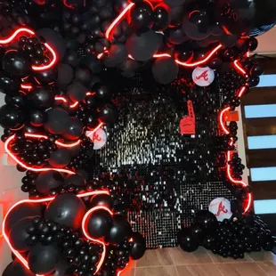 a black and red balloon installation