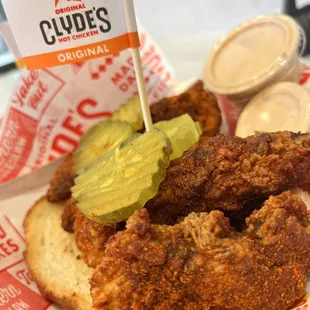 a fried chicken sandwich with pickles