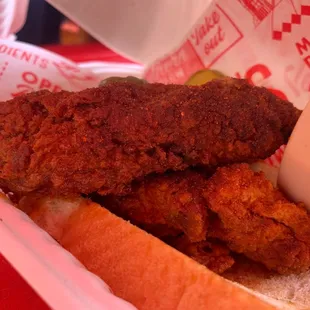 a fried chicken sandwich in a basket