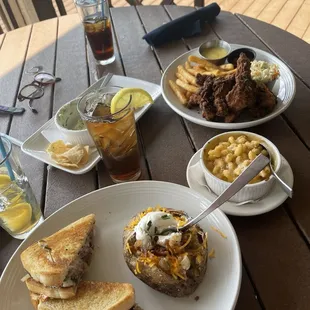 Tenders with fries and coleslaw with honey mustard as the dipping sauce. Steak sandwich with a loaded baked potato and mac. Artichoke dip.