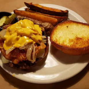 A whiskey burger and potato wedges.