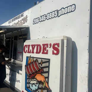 a man standing in front of a food truck