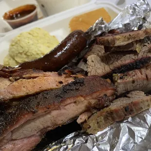 2 Meat Platter (brisket and ribs - both dry but smoky) plus Hot Link  (spicy). Sides: cornbread, potato salad, baked beans