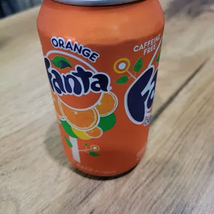 a can of orange soda