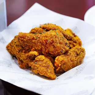 a plate of fried chicken on a table