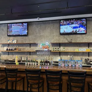 a bar with a large screen tv