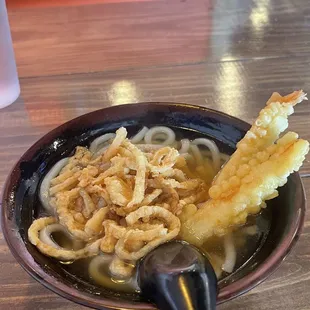 Udon with shrimp tempura &amp; crispy onions.