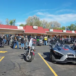 motorcycles parked in a parking lot