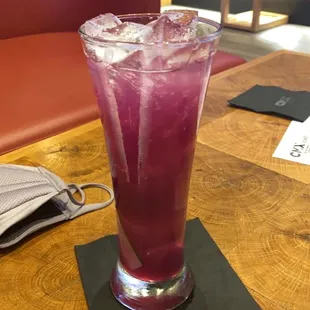 a purple drink with ice