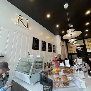 Front counter, menu and pastries