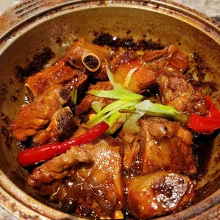 Hot, bold, and sweet chopped ribs in clay pot care not to burn yourself. Tip get some steam rice with this as it is naturally salty
