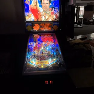 a pinball machine in a dark room