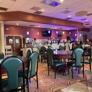 a restaurant with tables and chairs