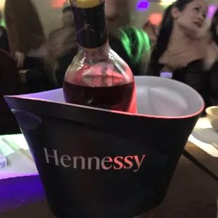 a bottle of wine in a bucket