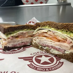 Spitfire sandwich 
Turkey,salami, tomato, pickles, pickled onions, lettuce, Mayo, avocado and house sauce.