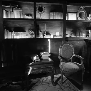 a chair and bookshelf