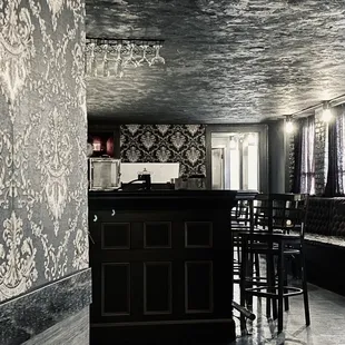 a black and white photo of a kitchen