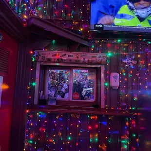 a television and christmas lights