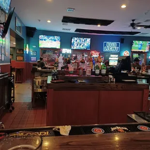 a sports bar with a large screen tv
