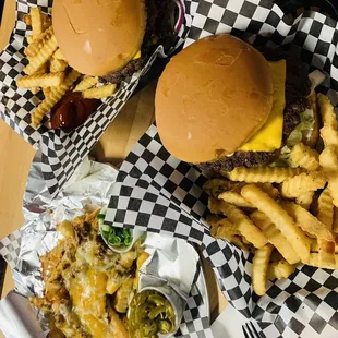 a cheeseburger and fries on a table