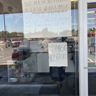 a sign in the window of a store