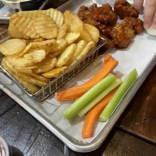 Boneless bbq wings with waffle fries.