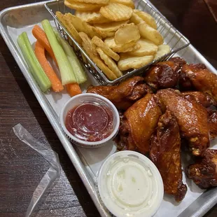 BBQ wings with waffle fries.