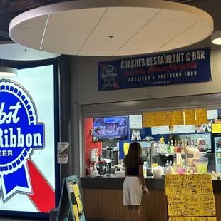 The stand with its homemade signs and a repeat customer.
