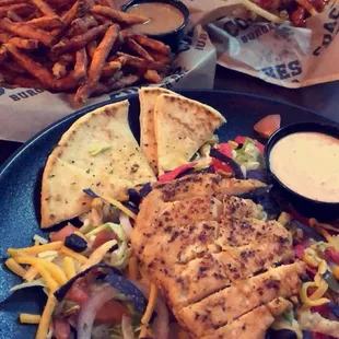 a plate of food with a sandwich and fries