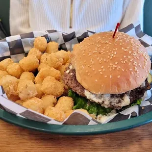 Cĺoach&apos;s Classic Cheeseburger  - burger topped with blue cheese,  lettuce tomato, and onion served with Tater Tots.