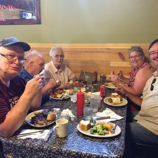 a group of men eating together