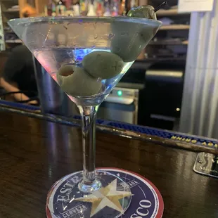 a martini with olives in it