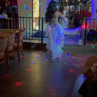 a woman dancing on the dance floor
