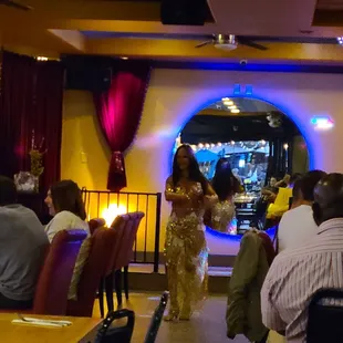 a woman walking through the dining room