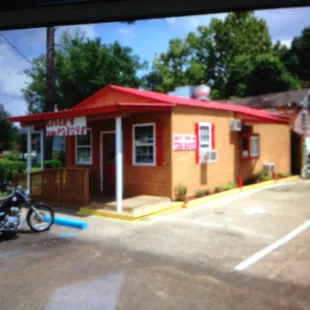a motorcycle parked in front of a restaurant